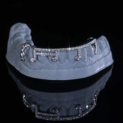 Custom grillz worn by Q. Jones Dental Couture client