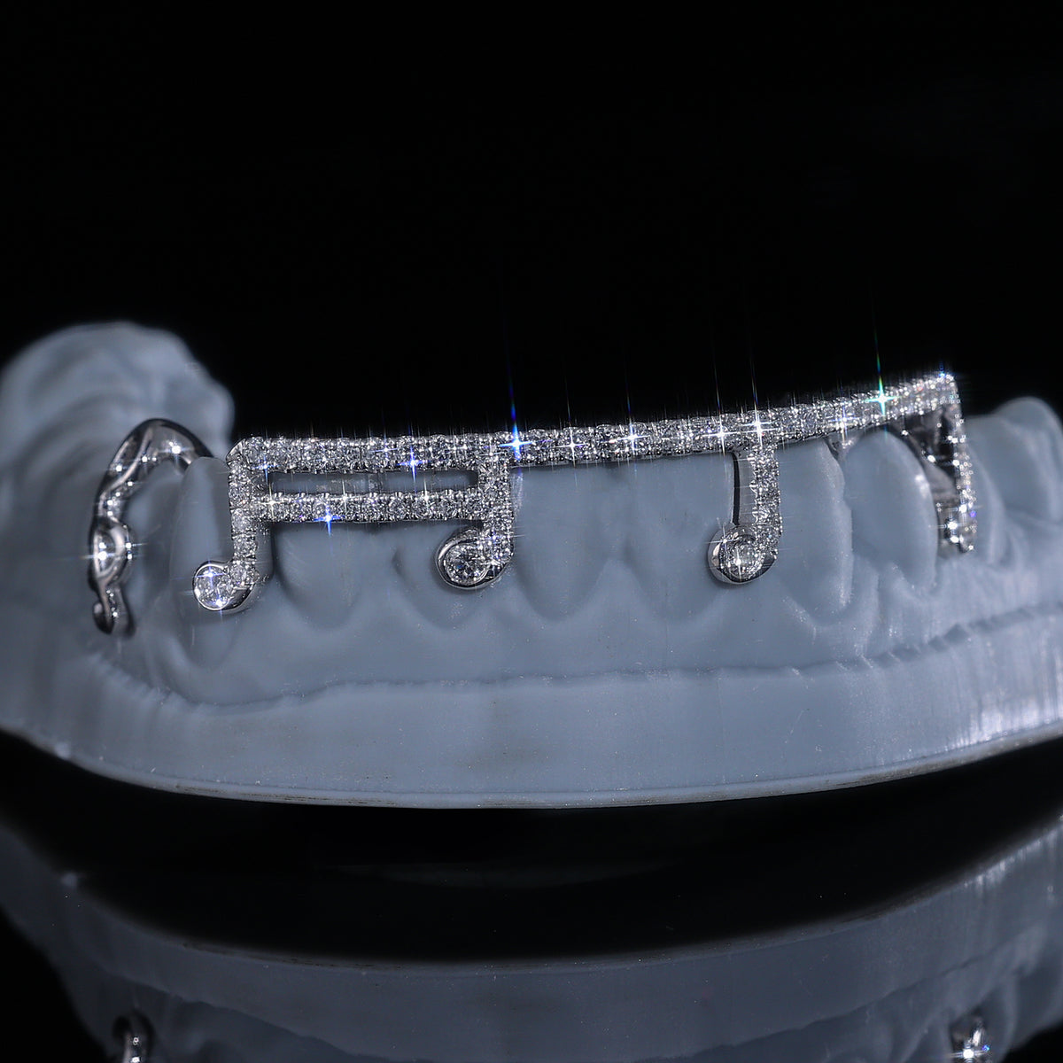 Gold and diamond custom grillz by Q. Jones Custom