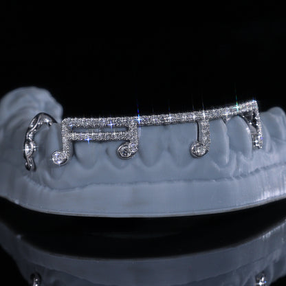 Gold and diamond custom grillz by Q. Jones Custom