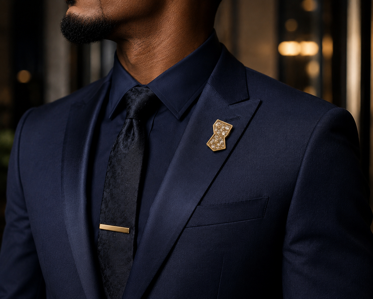Symbols of Ambition lapel pin worn with navy suit