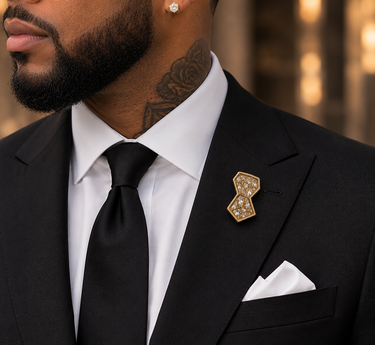 Symbols of Ambition lapel pin worn with black suit