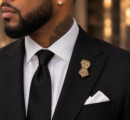 Symbols of Ambition lapel pin worn with black suit